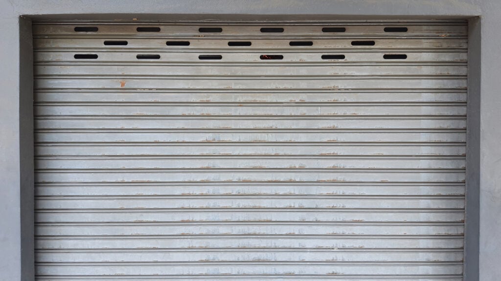 Steel roller shutter door on a commercial warehouse exterior